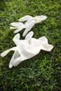 Disposable anti Coronavirus gloves thrown on the ground