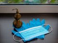 Disposable blue medical gloves, mask and bronze Chinese health symbol pumpkin Wu Lou