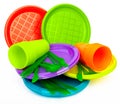 Disposable bright plastic kitchenware stacked on white Royalty Free Stock Photo