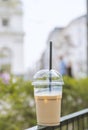 Disposable coffee cup with city view on background Royalty Free Stock Photo