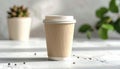 Disposable coffee cup with plant and coffee beans on table Royalty Free Stock Photo