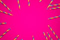 Disposable colorful paper straws on pink background