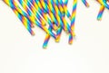 Disposable colorful paper straws on white background