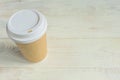 Disposable craft paper coffee cup. Coff to go on wooden table Royalty Free Stock Photo