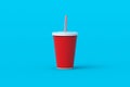 Disposable cup for beverages with straw. Plastic or paper package for soda drink. Cinema accessories. Royalty Free Stock Photo