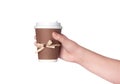 Disposable cup of coffee in hand