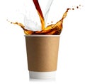 Disposable cup with coffee and milk splashes Royalty Free Stock Photo