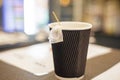 disposable cup with tea bag. snack, Royalty Free Stock Photo