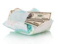 Disposable diaper and money close up isolated on white.