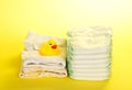 Disposable diapers, clothes and rubber duckling Royalty Free Stock Photo