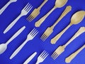 Disposable ecological wooden bamboo and biodegradable plastic fork and spoon pattern on a trendy blue background. Environment Royalty Free Stock Photo