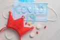 Disposable face mask and pills on light background Royalty Free Stock Photo
