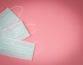 Disposable hygienic masks on pink background . protection against pm2.5 and COVID-19 concept