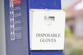 Disposable latex gloves holder at fuel pump station garage