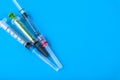 Disposable medical hypodermic syringes on a blue background. Copy space Royalty Free Stock Photo