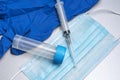 disposable medical mask,syringe, disposable blue glove, test tube for analysis Royalty Free Stock Photo