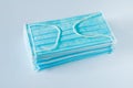 Disposable medical masks on a blue background