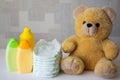 Disposable nappies, baby accessories and teddy bear