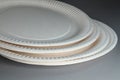Disposable paper plates close-up. Disposable dishes. Soft focus Royalty Free Stock Photo