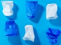 Disposable plastic cups on a blue background. the concept of abandoning plastic. the use of plastic Royalty Free Stock Photo