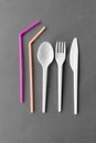 Disposable plastic fork, knife, spoon and straws Royalty Free Stock Photo