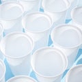 Disposable plastic white empty cups Royalty Free Stock Photo