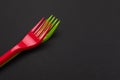 Disposable red and green plastic forks isolated on background Royalty Free Stock Photo