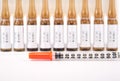 Disposable syringe on injection ampule Royalty Free Stock Photo
