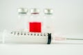 Disposable syringe and injection vials background Royalty Free Stock Photo