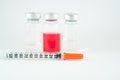 Disposable syringe and injection vials background Royalty Free Stock Photo