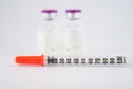 Disposable syringe on injection vials Royalty Free Stock Photo