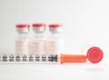Disposable syringe on injection vials Royalty Free Stock Photo