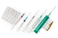 Disposable syringes different sizes and ampules of medications, top view