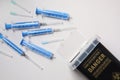Disposable syringes, needles and sharps container on light background, flat lay