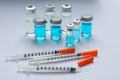 Disposable syringes with needles and vials on white background Royalty Free Stock Photo