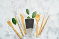 Disposable tableware made of environmental materials. Paper, bamboo glasses, cocktail tubes. Wooden forks and knives. Plastic free Royalty Free Stock Photo