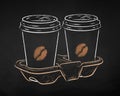 Disposable takeaway paper coffee cups in holder