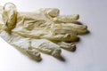 Disposable white latex gloves on white background, protective gloves during coronavirus pandemic - Image