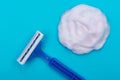 Disposable Women Razor and shaving foam isolated on blue Royalty Free Stock Photo