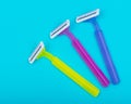 Disposable Women Razors  on blue Royalty Free Stock Photo