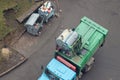 Disposal of municipal waste using a special car garbage truck, the garbage is loaded into the car Royalty Free Stock Photo