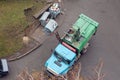 Disposal of municipal waste using a special car garbage truck, the garbage is loaded into the car Royalty Free Stock Photo