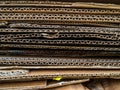 Disposal of old cardboard boxes. A pile of cardboard boxes stacked on top of each other. Boxes for further processing Royalty Free Stock Photo