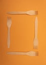 Disposible forks on a yellow background .flat lay Royalty Free Stock Photo