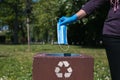 disposing of protective mask in recycle bin Royalty Free Stock Photo