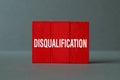 Disqualification - - word concept on building blocks, text