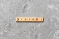 DISRUPT word written on wood block. DISRUPT text on cement table for your desing, concept Royalty Free Stock Photo