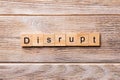 DISRUPT word written on wood block. DISRUPT text on wooden table for your desing, concept Royalty Free Stock Photo
