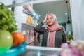 dissapointed woman while opening the fridge door Royalty Free Stock Photo