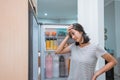 dissapointed woman while opening the fridge door Royalty Free Stock Photo